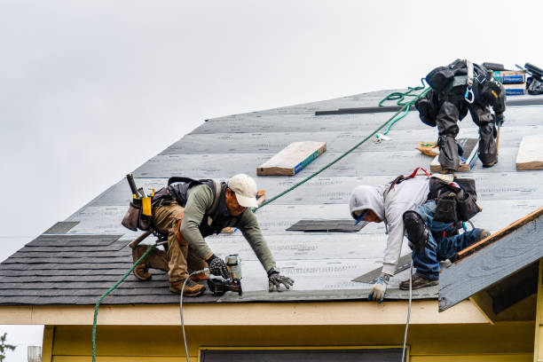 Professional Gutter Installation technician working in Rochester, NY